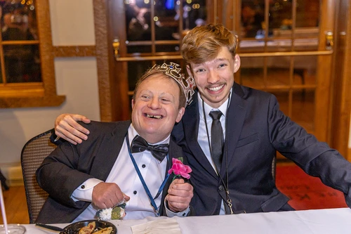 Buddies dining at Night to Shine